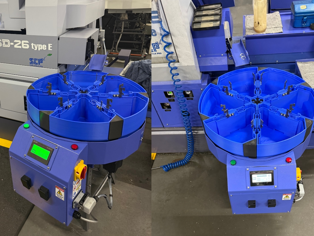 two rotary machined component collectors positioned with two Star CNC lathes in a factory