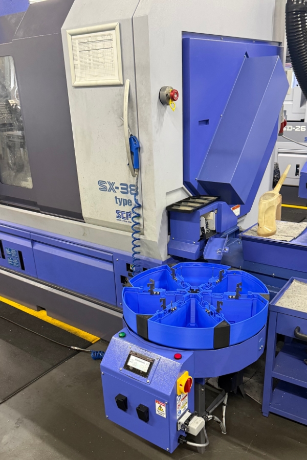 RPH600 rotary component collector manufactured by J&S Engineering installed in a UK factory to collect machines turned parts from a Star SX-38 type lathe